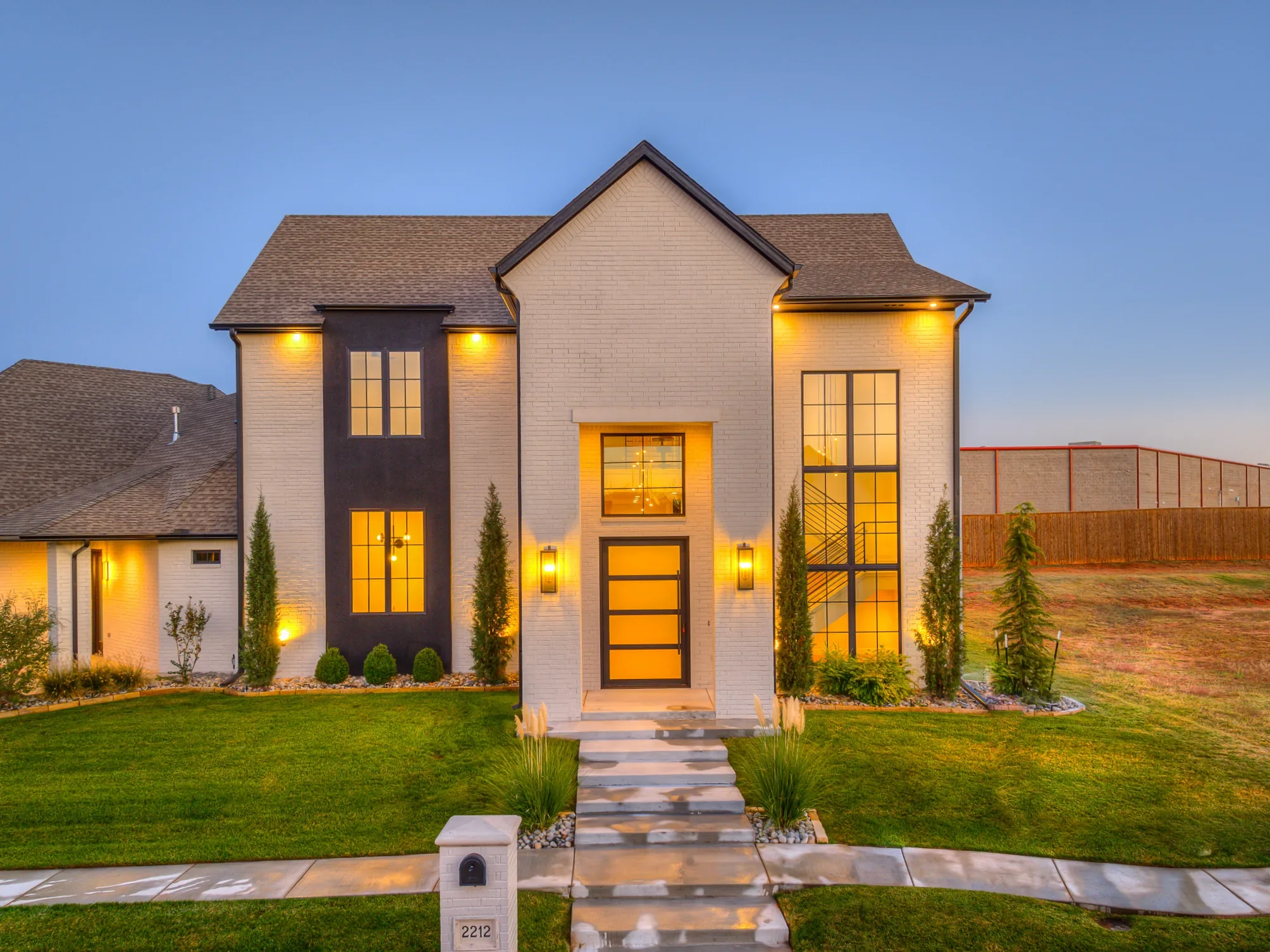 Front exterior of 2212 Stone Mill Ct illuminated at dusk