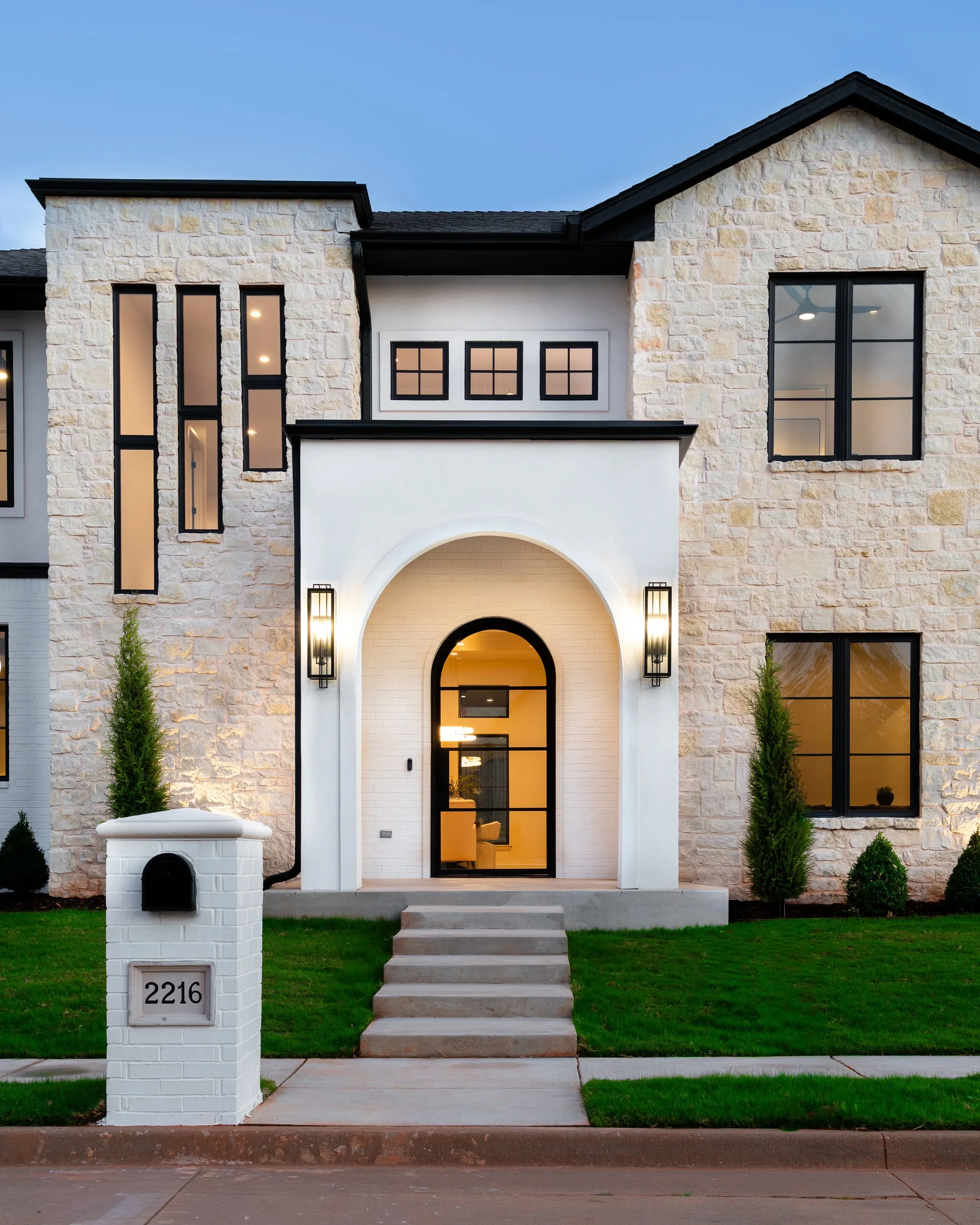 Arched entry and limestone exterior details on a Travis Horton Homes custom home
